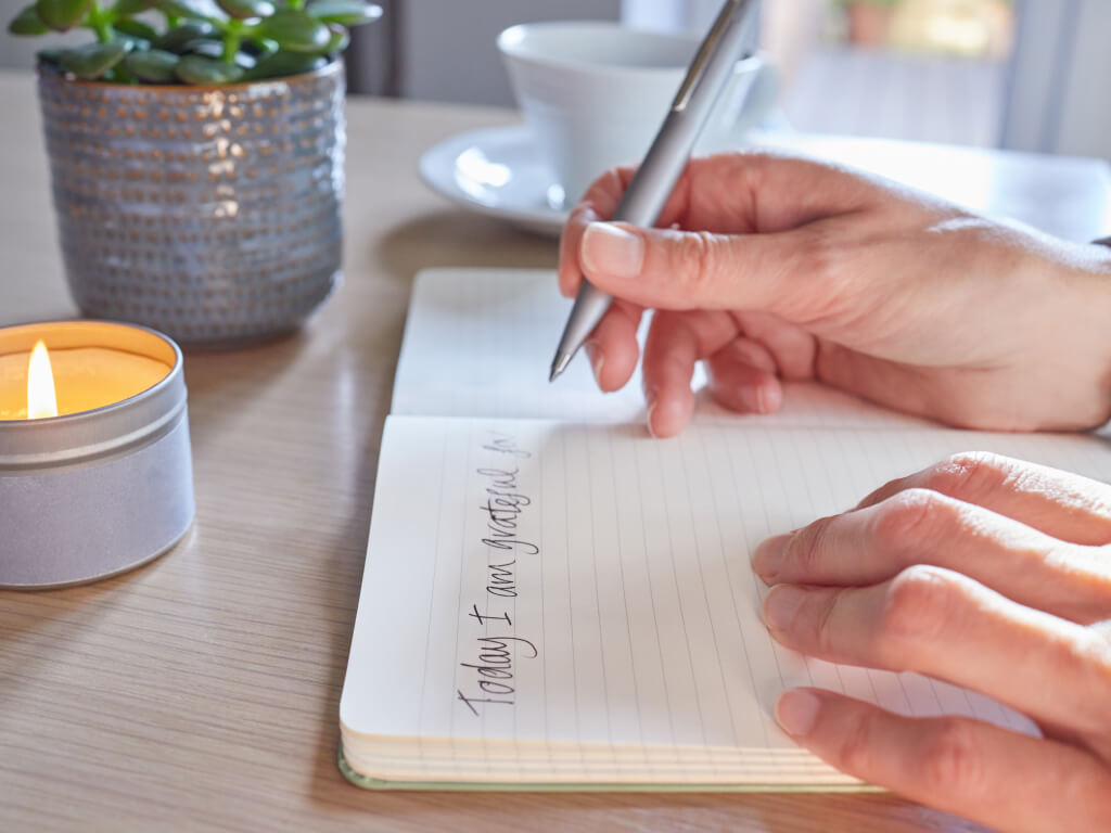 Woman writing in journal