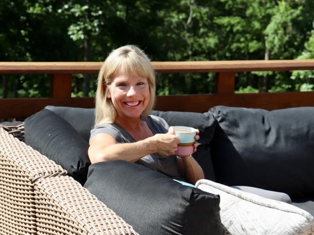 Regan sitting on couch smiling